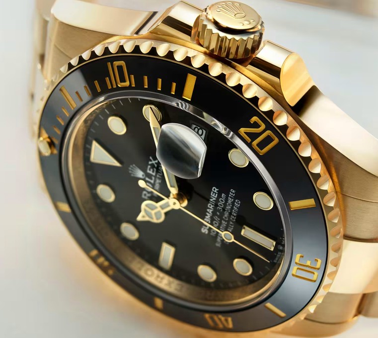 Close-up of a gold Rolex Submariner dial